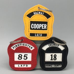 Three fire hydrants with numbers on them.